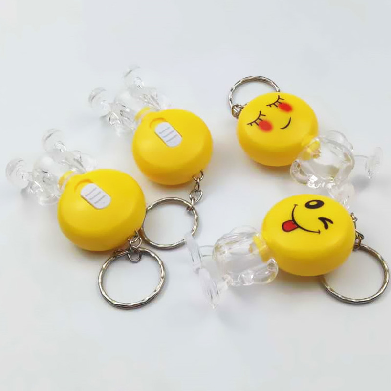 Gele emotiesleutelhanger